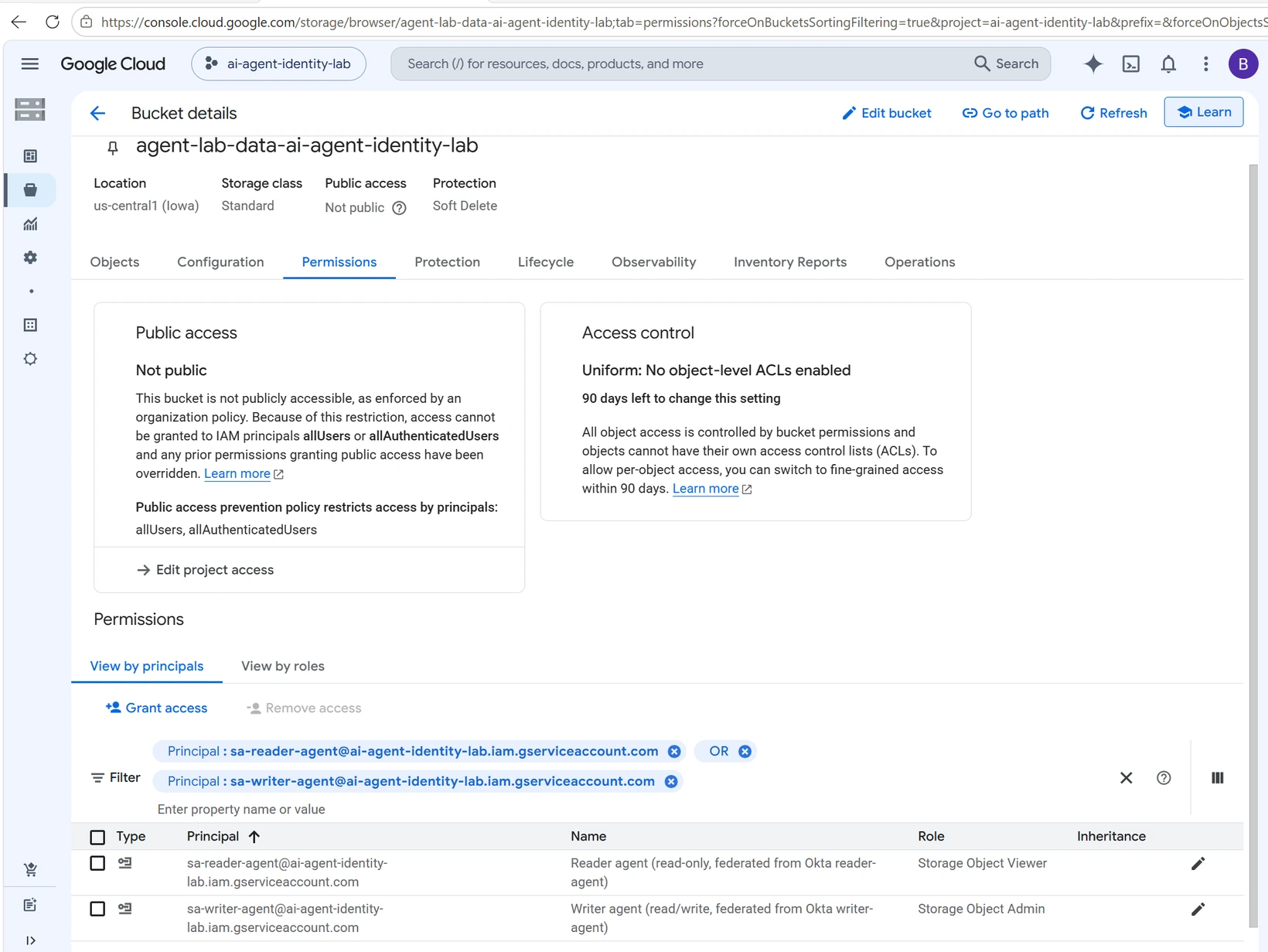 The bucket Permissions tab filtered to the two service accounts with different roles