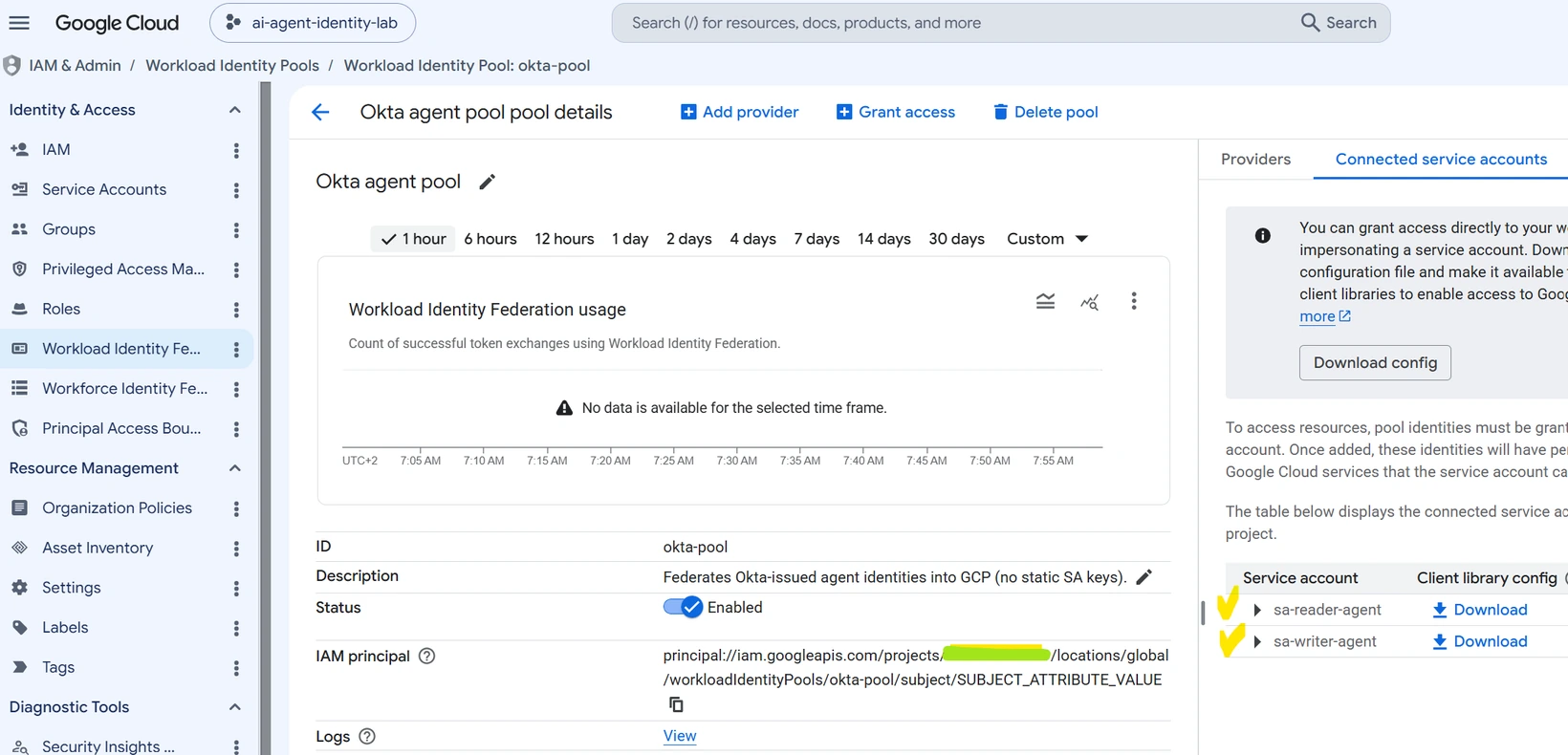 The okta-pool details page listing the two connected service accounts